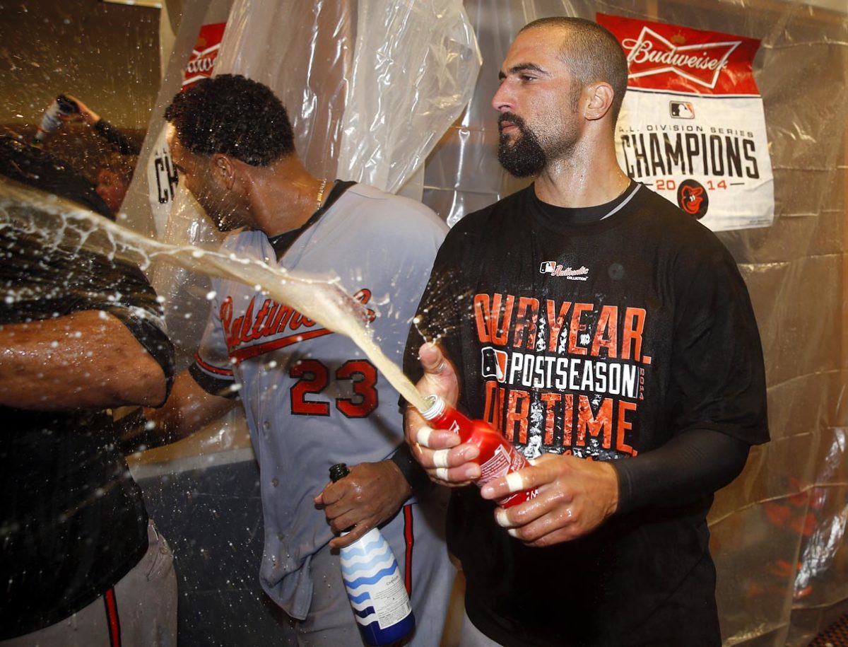 2014-1005-Baltimore-Orioles-Nick-Markakis-Nelson-Cruz-celebrate.jpg