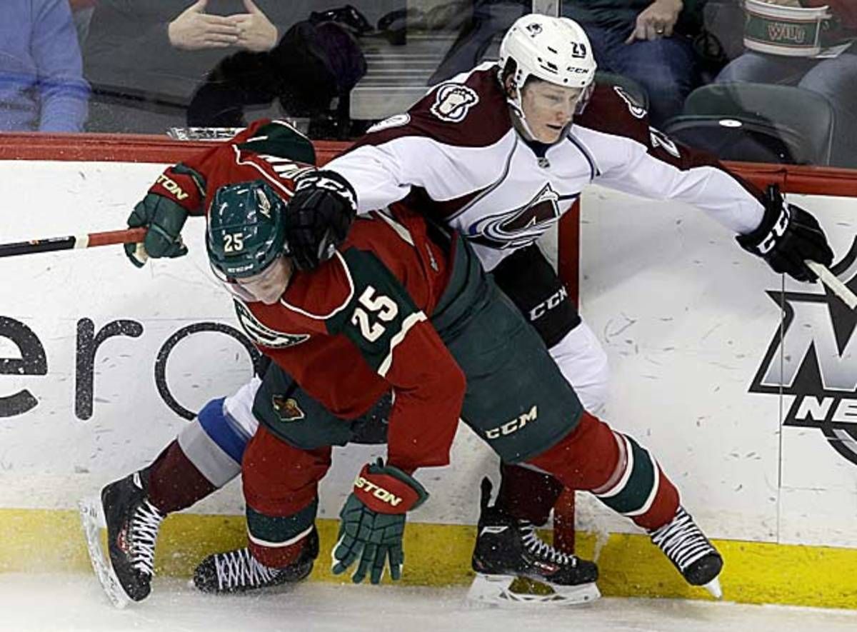 Jonas Brodin of the Minnesota Wild and Nathan MacKinnon of the Colorado Avalanche