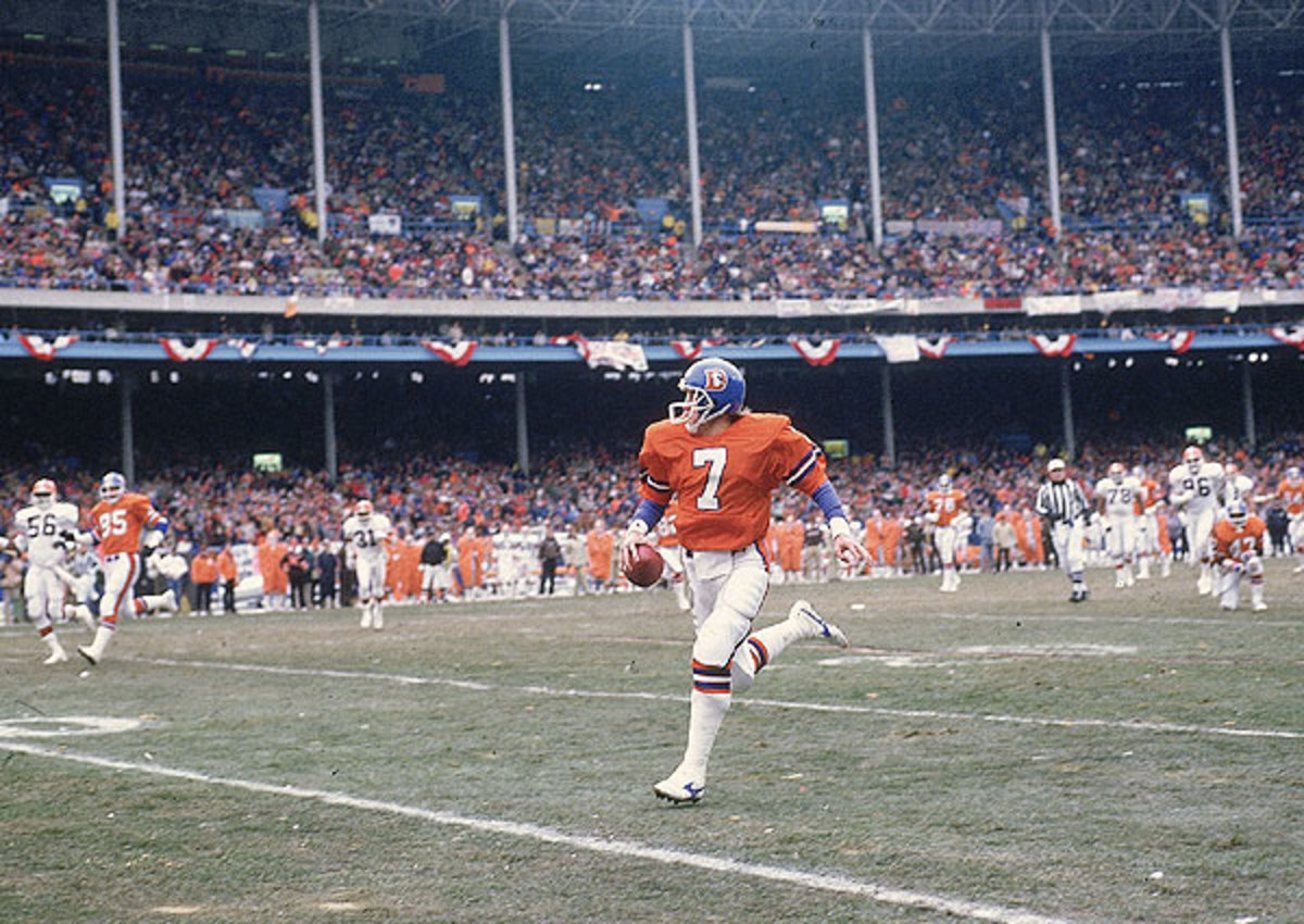 John Elway drives the Broncos down the field during the AFC title game in 1986. 