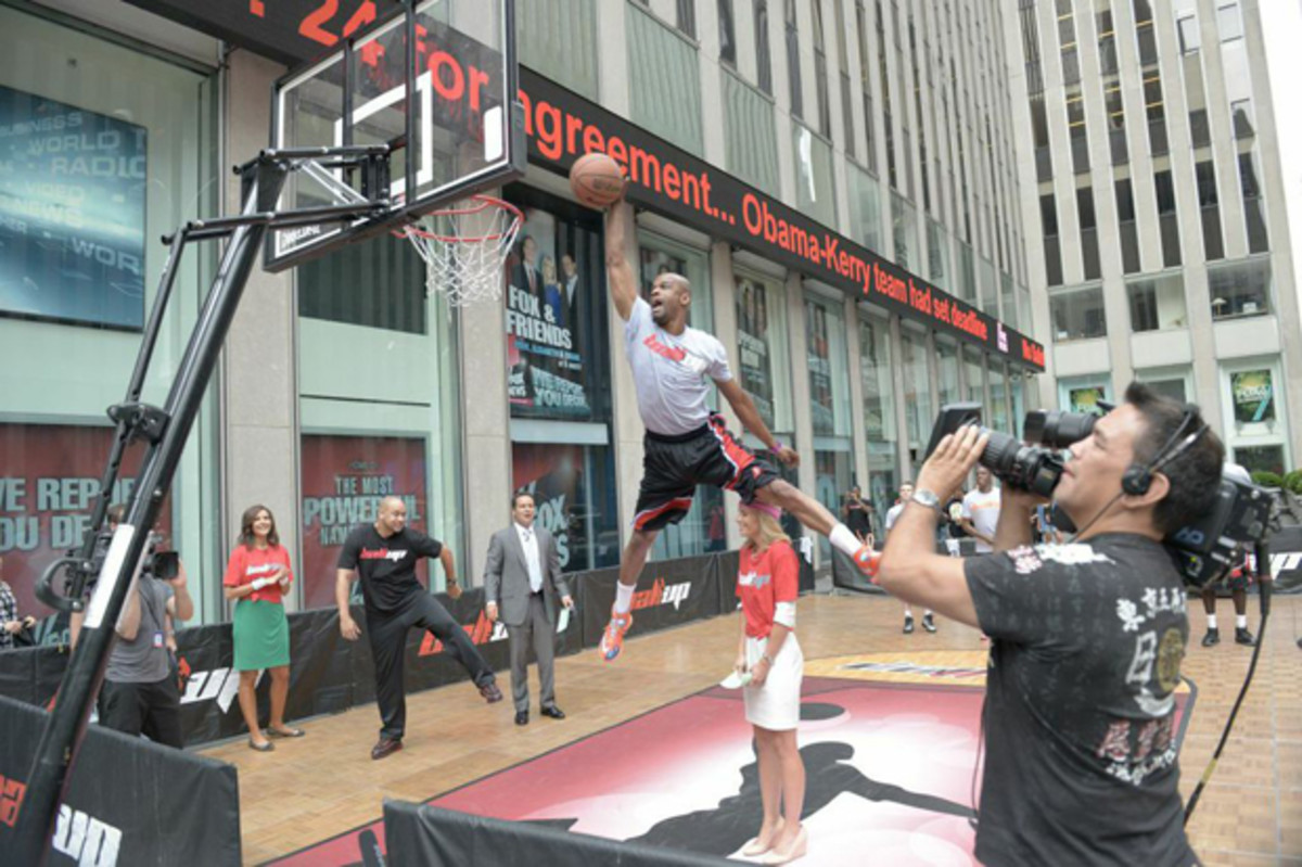 Taurian Fontenette (a.k.a. - Air Up There) dunks over Elisabeth Hasselbeck during an appearance on Fox & Friends.