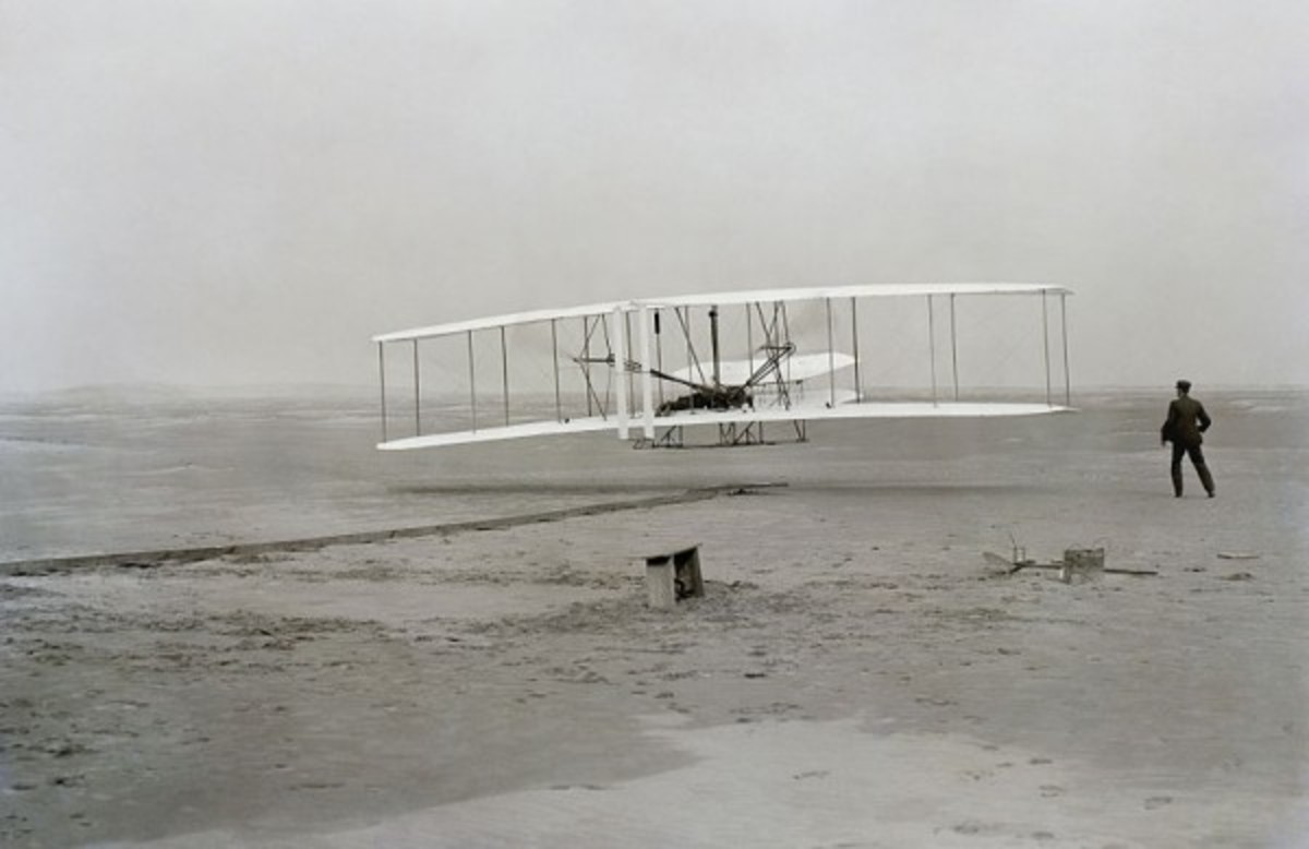 The first successful flight of the Wright Flyer.