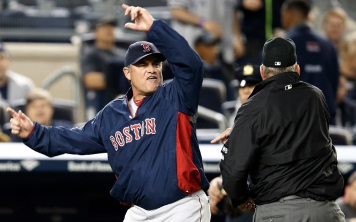Boston Red Sox manager John Farrell is tossed after arguing with the umpires on Sunday. (AP Photo/Kathy Willens)