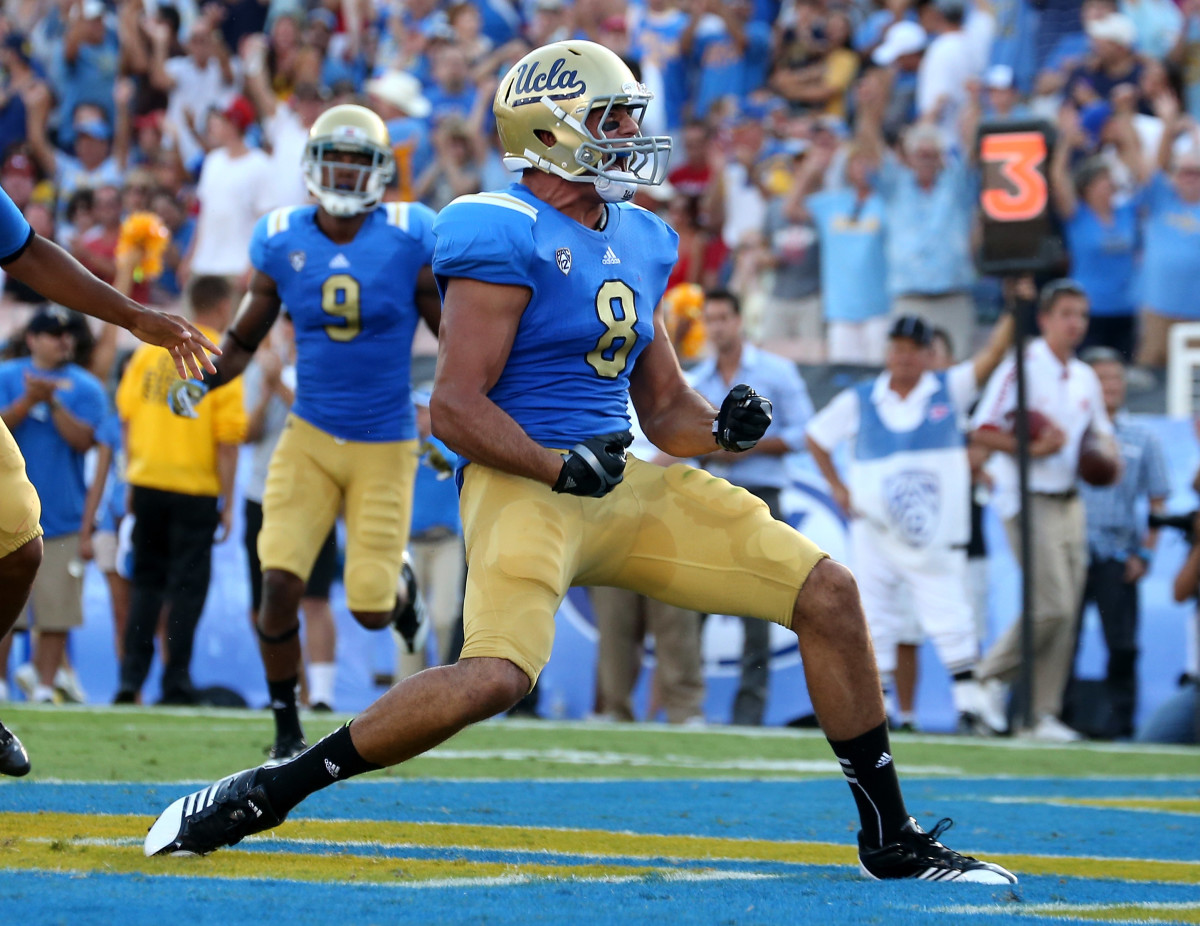 Joseph Fauria (#8) of the UCLA Bruins celebrates a four yard touchdown catch in the second quarter against the Nebraska Cornhuskers at the Rose Bowl on September 8, 2012 in Pasadena, California. 