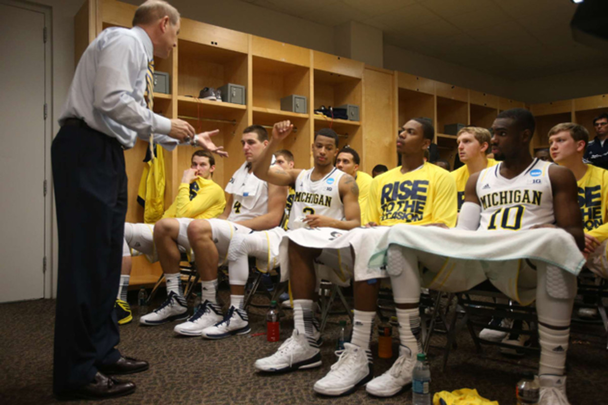 Tim Hardaway Jr. and his teammates listen to head coach John Beilein in the locker room during the second round of the NCAA Tournament in 2013.