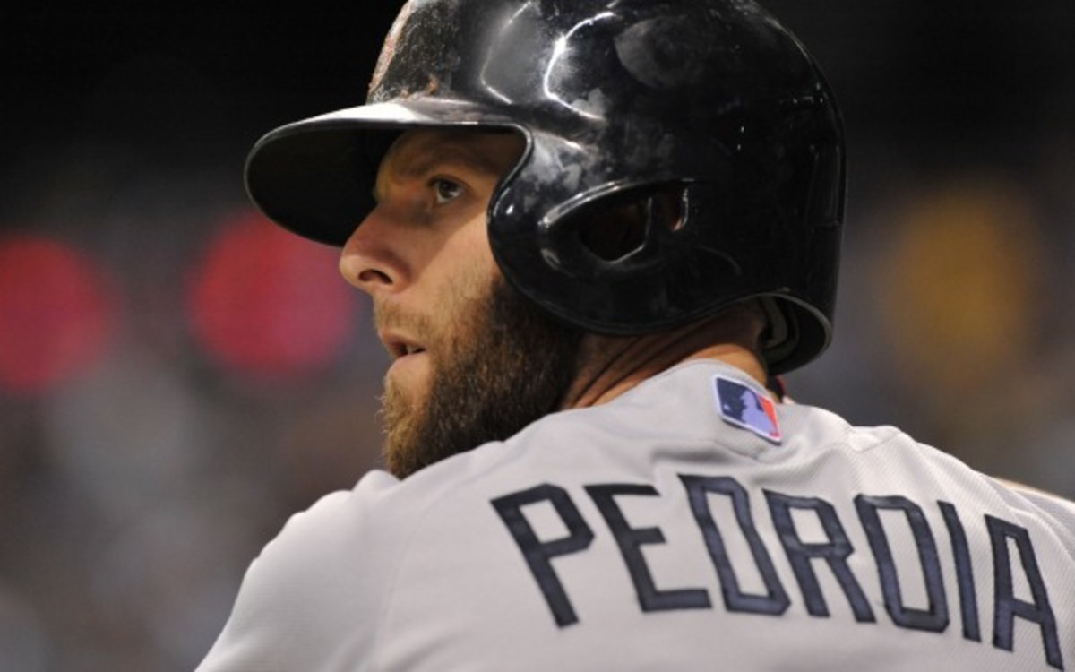 Dustin Pedroia and the Red Sox are talking about a contract extension. (Al Messerschmidt/Getty Images)