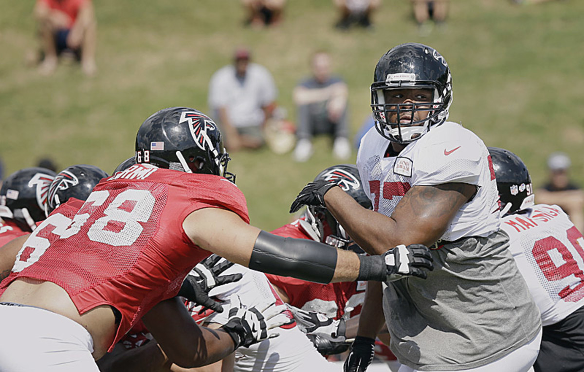 Ra'Shede Hageman (in white) is part of a rebuilt defensive line that must generate a pass rush. (Brynn Anderson/AP)