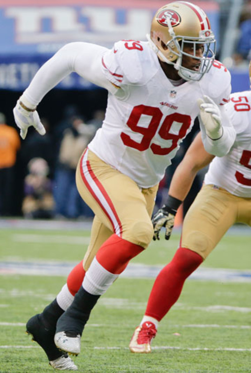 Aldon Smith played his first game of the season Sunday after completing his nine-game suspension last week. (Julio Cortez/AP)