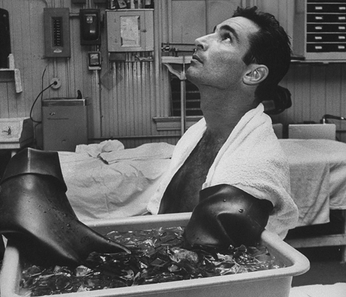 Koufax, shown here after facing the Mets on Sept. 6, 1966, retired due to traumatic arthritis in his left arm.
