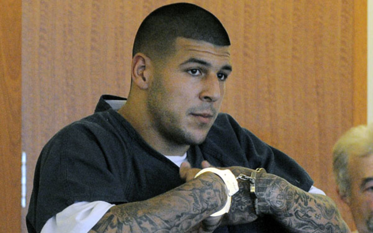 Former NFL playerAaron Hernandez is charged with three counts of murder.  (AP Photo/Boston Herald, Ted Fitzgerald)