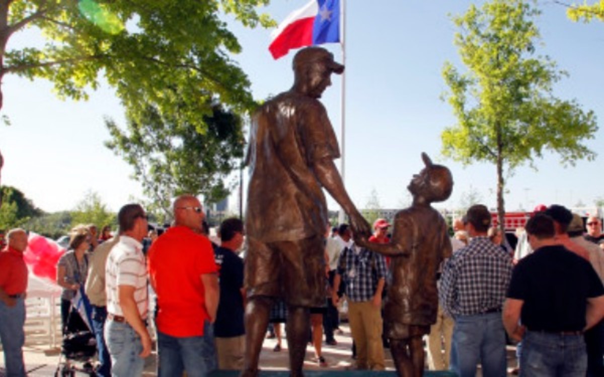 A statue honoring a fan that died at the Texas Rangers stadium was unveiled in 2012. (AP Photo/Sharon Ellman)