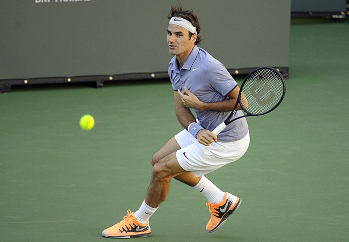 Roger Federer playing with Stanislas Wawrinka at Indian Wells has created intrigue in the doubles tournament. (Mark J. Terrill/AP)