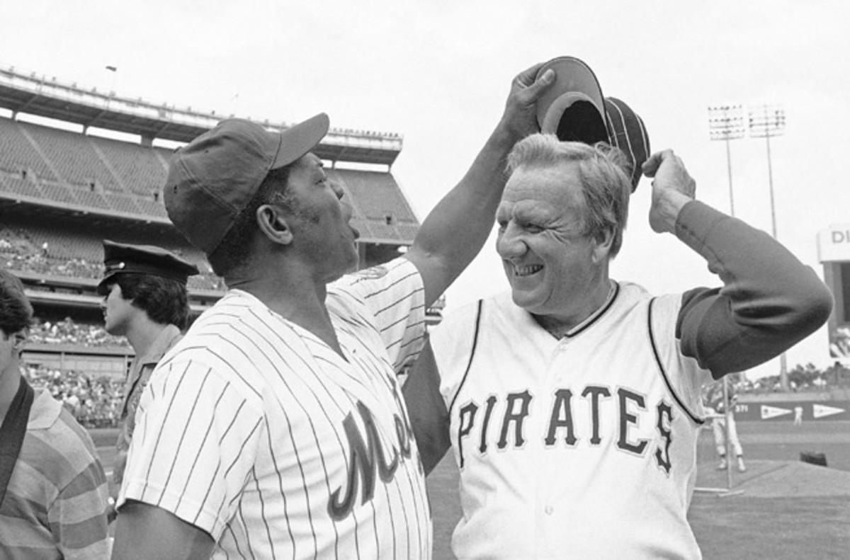 Baseball Hall of Fame slugger Ralph Kiner, right with Willie Mays, died at his home in California Thursday. He was 91.