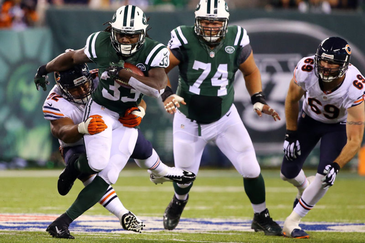Paea, here lassoing the Jets’ Chris Ivory, grew up playing rugby in Tonga. (Al Bello/Getty Images)