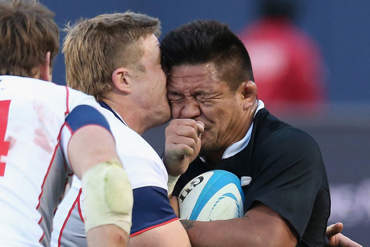 Mealamu might have wished he had a helmet on this hit from the USA’s Louis Stanfill. (Jonathan Daniel/Getty Images