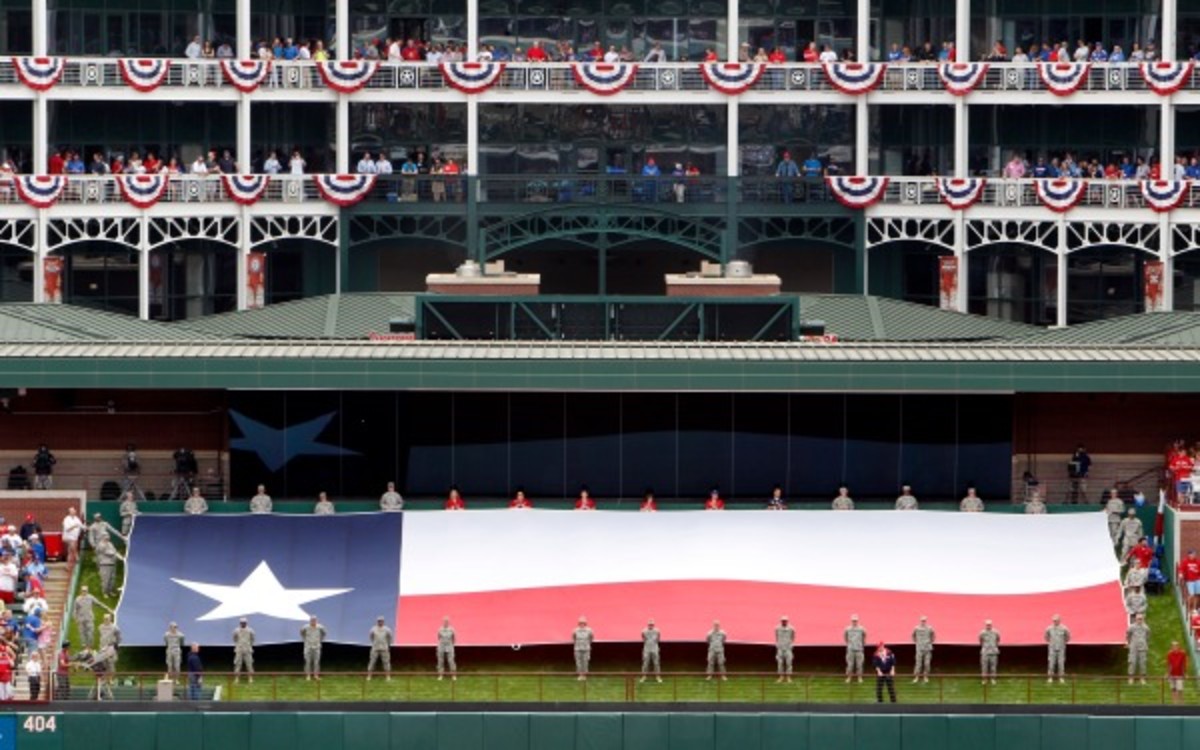 Fans watch the opening day ceremonies at the Texas Rangers home opener. (AP Photo/Tony Gutierrez)