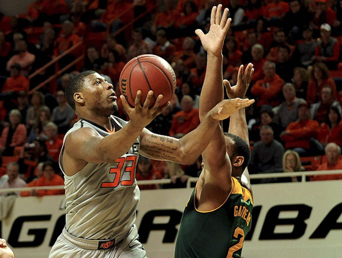 Marcus Smart (left) couldn't get into a rhythm as Oklahoma State lost to Baylor. (Brody Schmidt/AP)