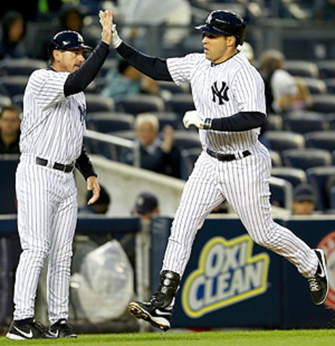 Mark Teixeira gets a high-five after hitting a solo home run vs. the Mariners.