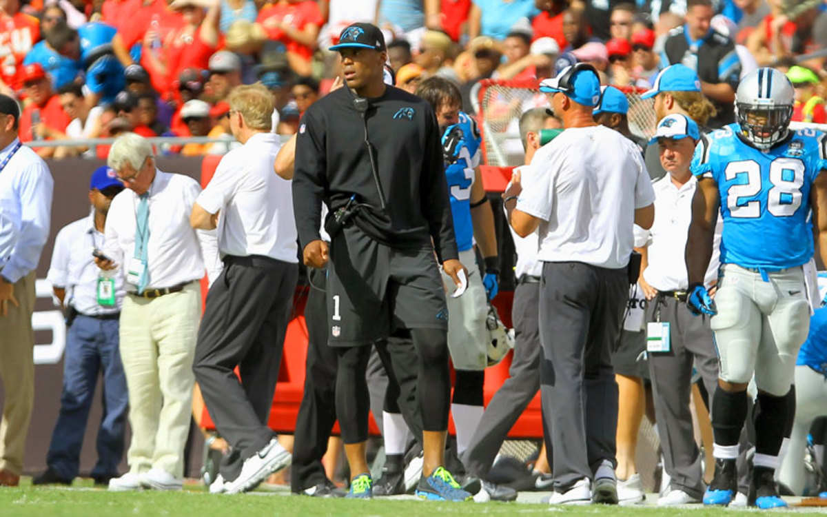 Cam Newton was inactive, but that didn’t stop him from running on the field to deliver a second-quarter pep talk during a break in the action. (Cliff Welch/Icon Sportswire)