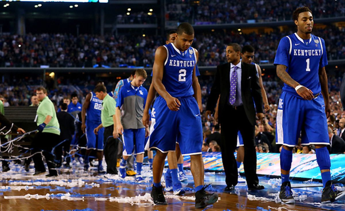 Aaron Harrison (No. 2) walks off the court after the loss to UConn. His Wildcats were never close enough for him to pull off another clutch shot.