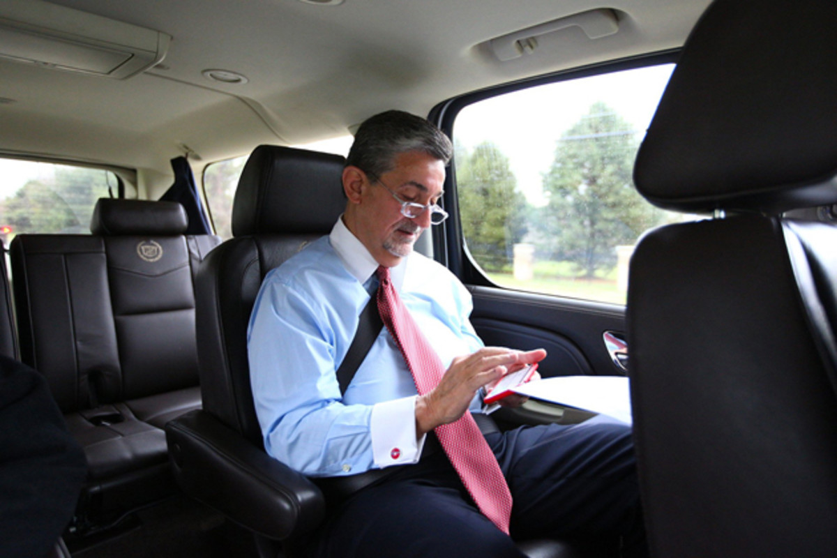 Leonsis answers emails and makes phone calls in the car en route to his destination.