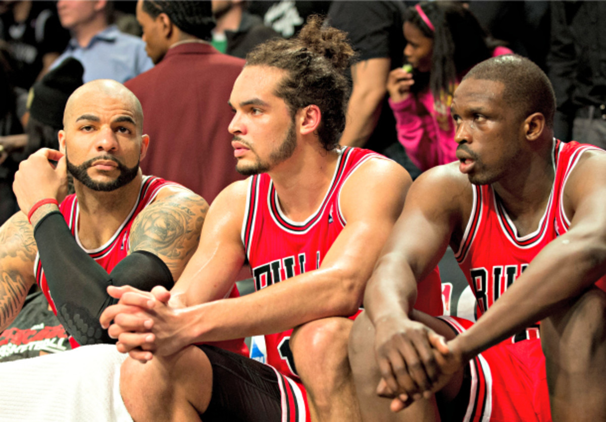Carlos Boozer (left) and Luol Deng (right) might not be Bulls beyond this season. (Don Emmert/AFP/Getty Images)