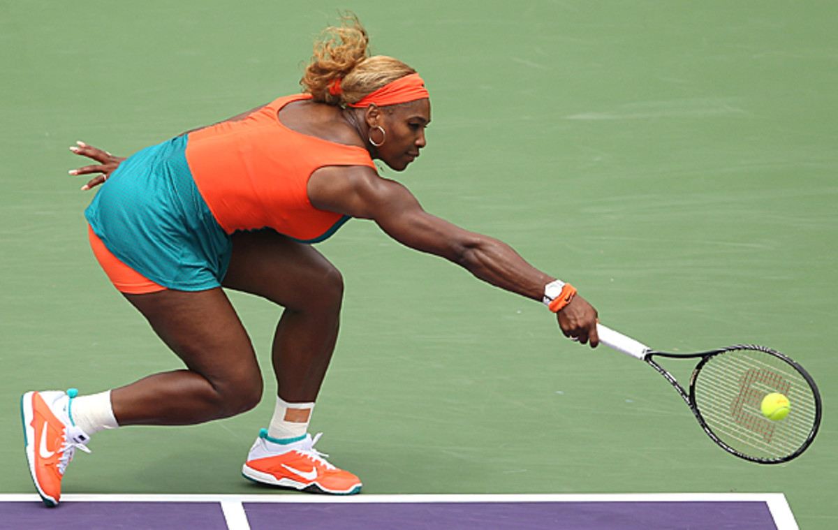 Serena barely breaks a sweat while stretching to reach this backhand. (Clive Brunskill/Getty Images)