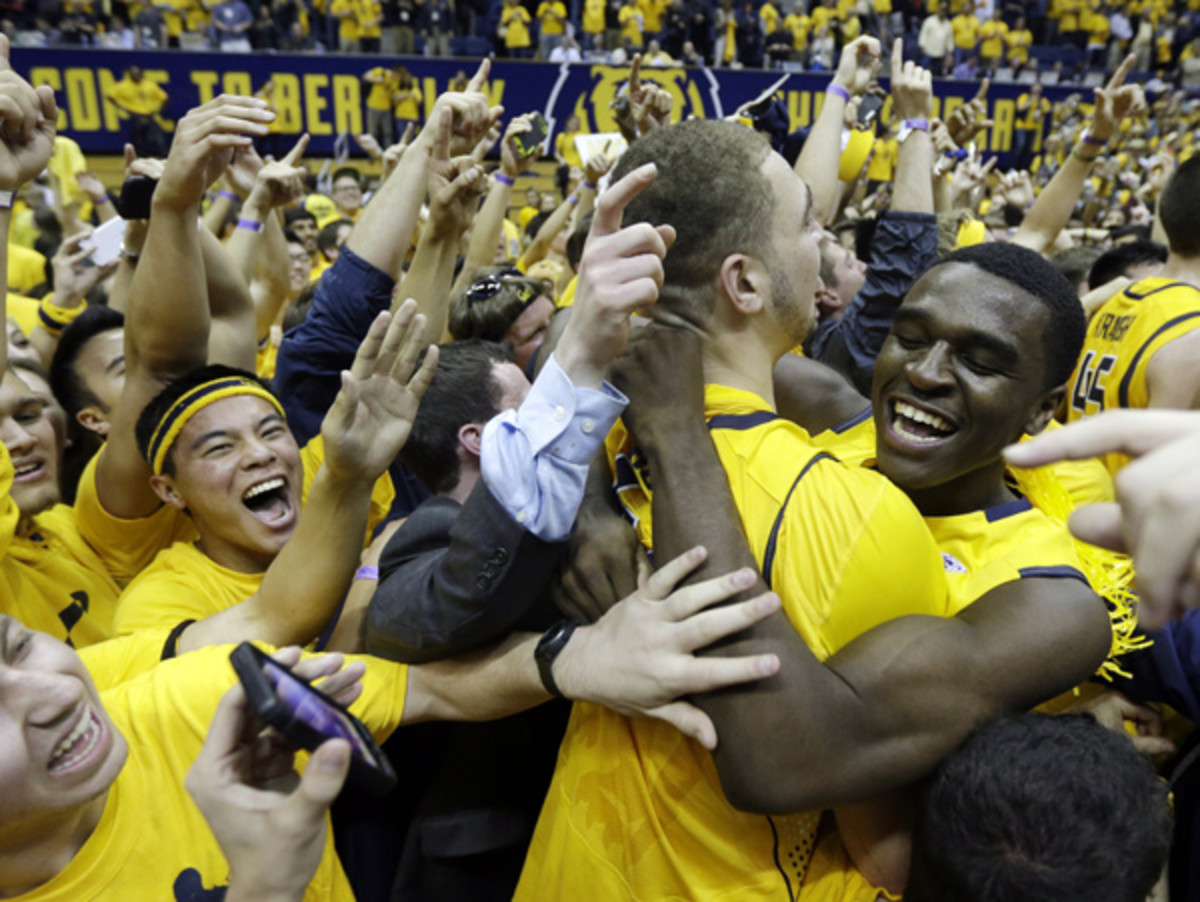 Cal fans celebrated on the court after the Bears' upset of No. 1 Arizona on Saturday night. (Marcio Jose Sanchez/AP)