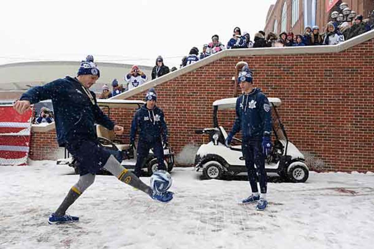 Members of the Toronto Maple Leafs warmed up at the 2014 Winter Classic with a soccer ball.