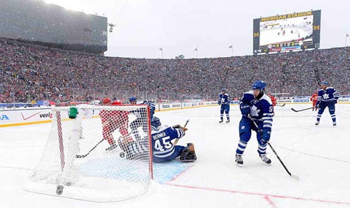 Daniel Alfredsson of the Detroit Red Wings scores a goal at the 2014 Winter Classic.
