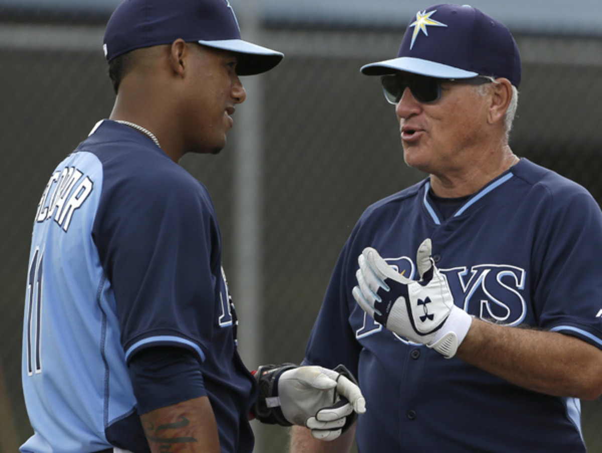 Joe Maddon educates Yunel Escobar on the importance of practice. (Steven Senne/AP)