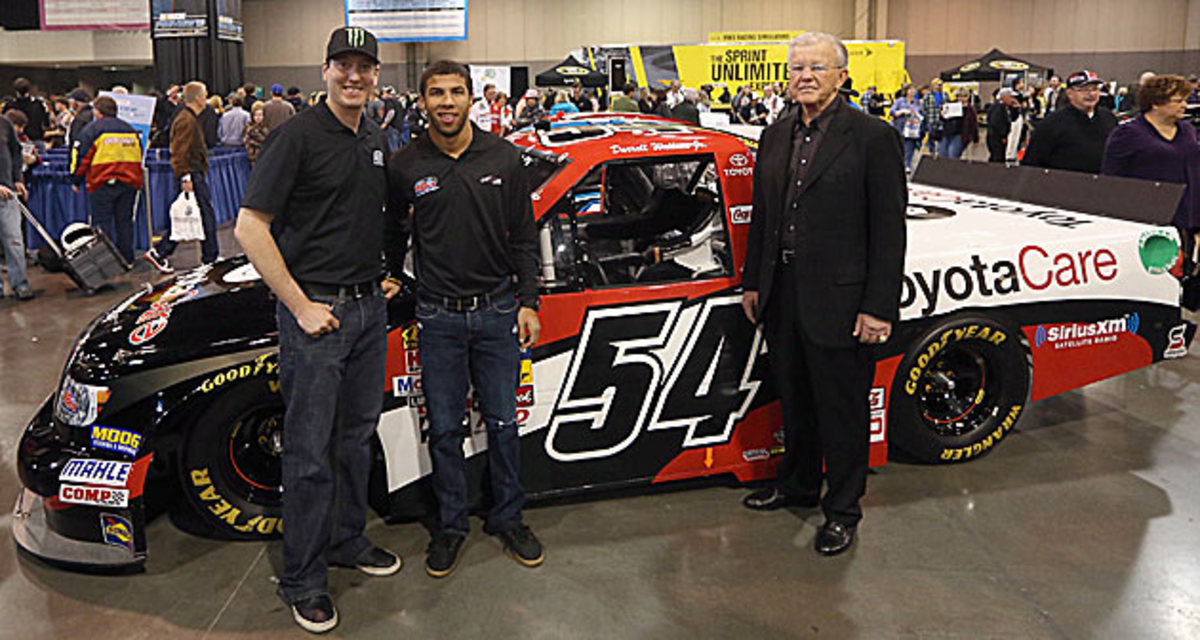 Team owner Joe Gibbs (right) hopes Darrell (with Kyle Busch) can do for black drivers what Doug Williams did for black quarterbacks when Gibbs was head coach of Washington's Super Bowl-winning team.
