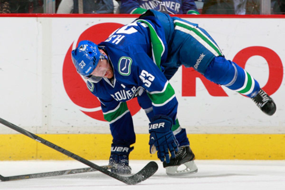 After being honored for his 1,000 NHL game milestone, Henrik Sedin left Sunday's game against the Sabres with an apparent leg injury. (Jeff Vinnick/NHLI via Getty Images)