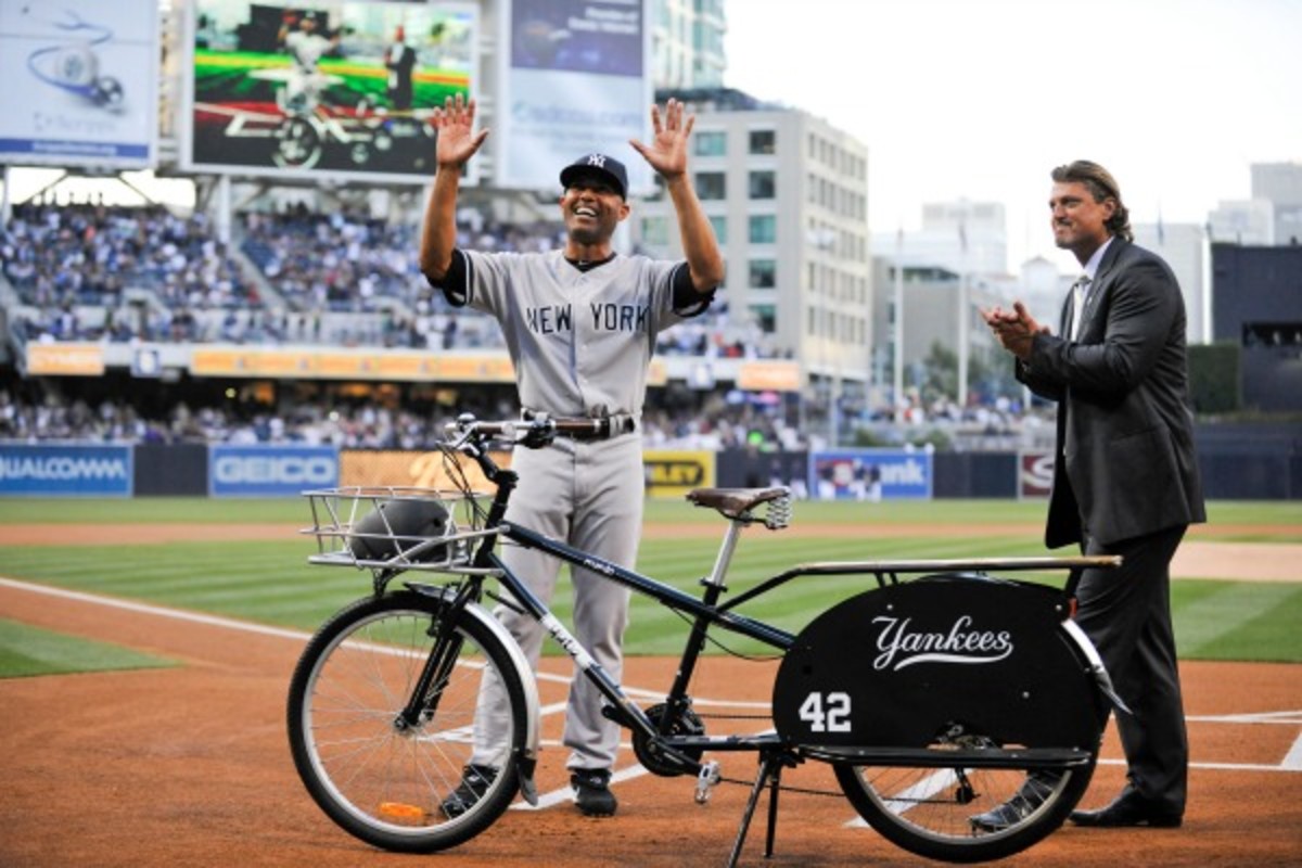 Trevor Hoffman (right) was there to present Mariano Rivera with a bike last season. (Denis Poroy/Getty Images)
