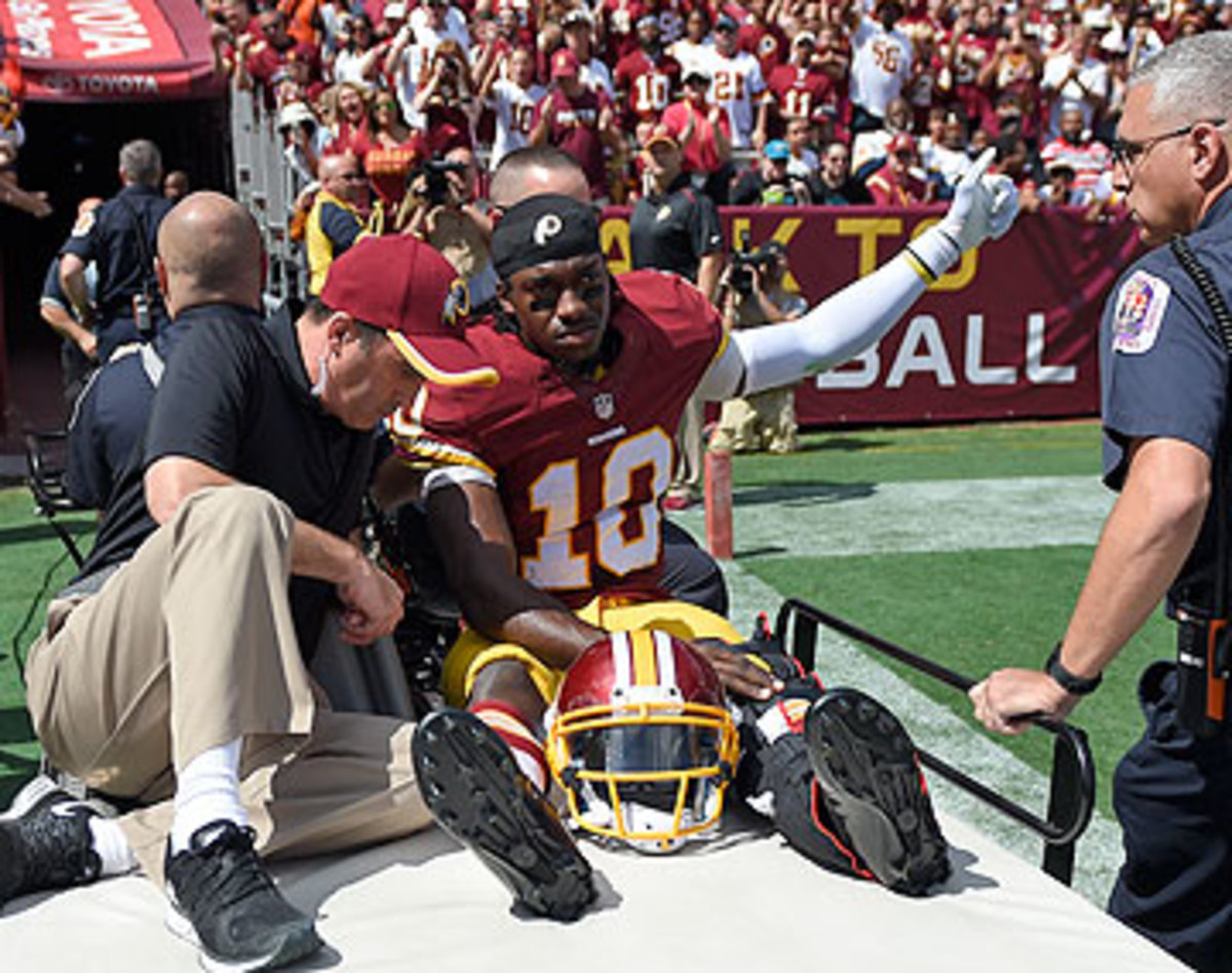 Robert Griffin III's season is in jeopardy after he dislocated his ankle on Sunday. (Nick Wass/AP)