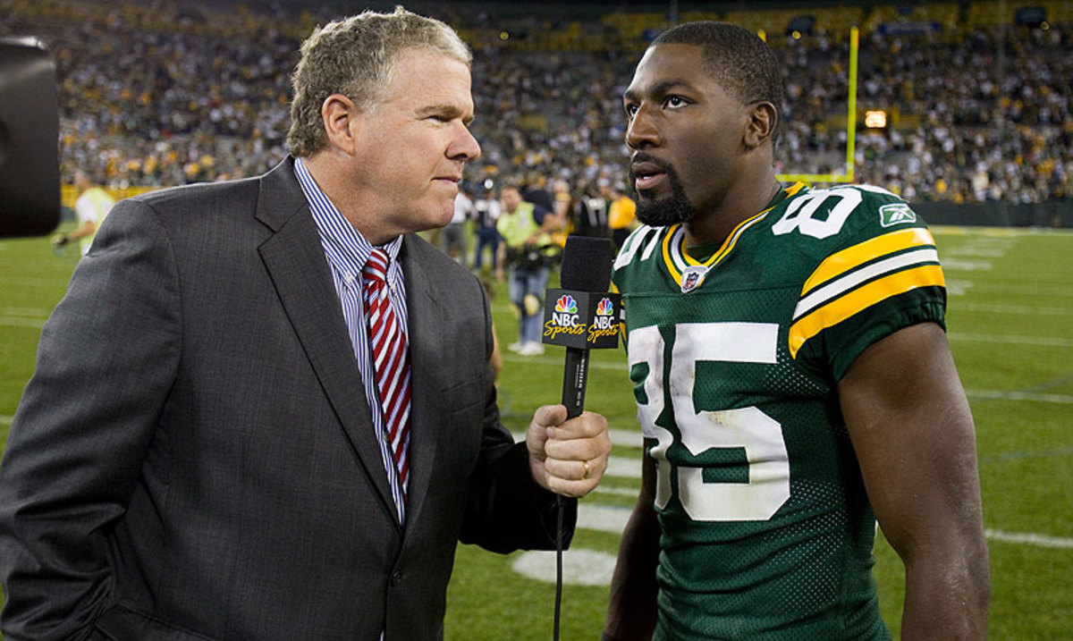 The author with then-Packer Greg Jennings after a game in 2011. (David Stluka/AP)