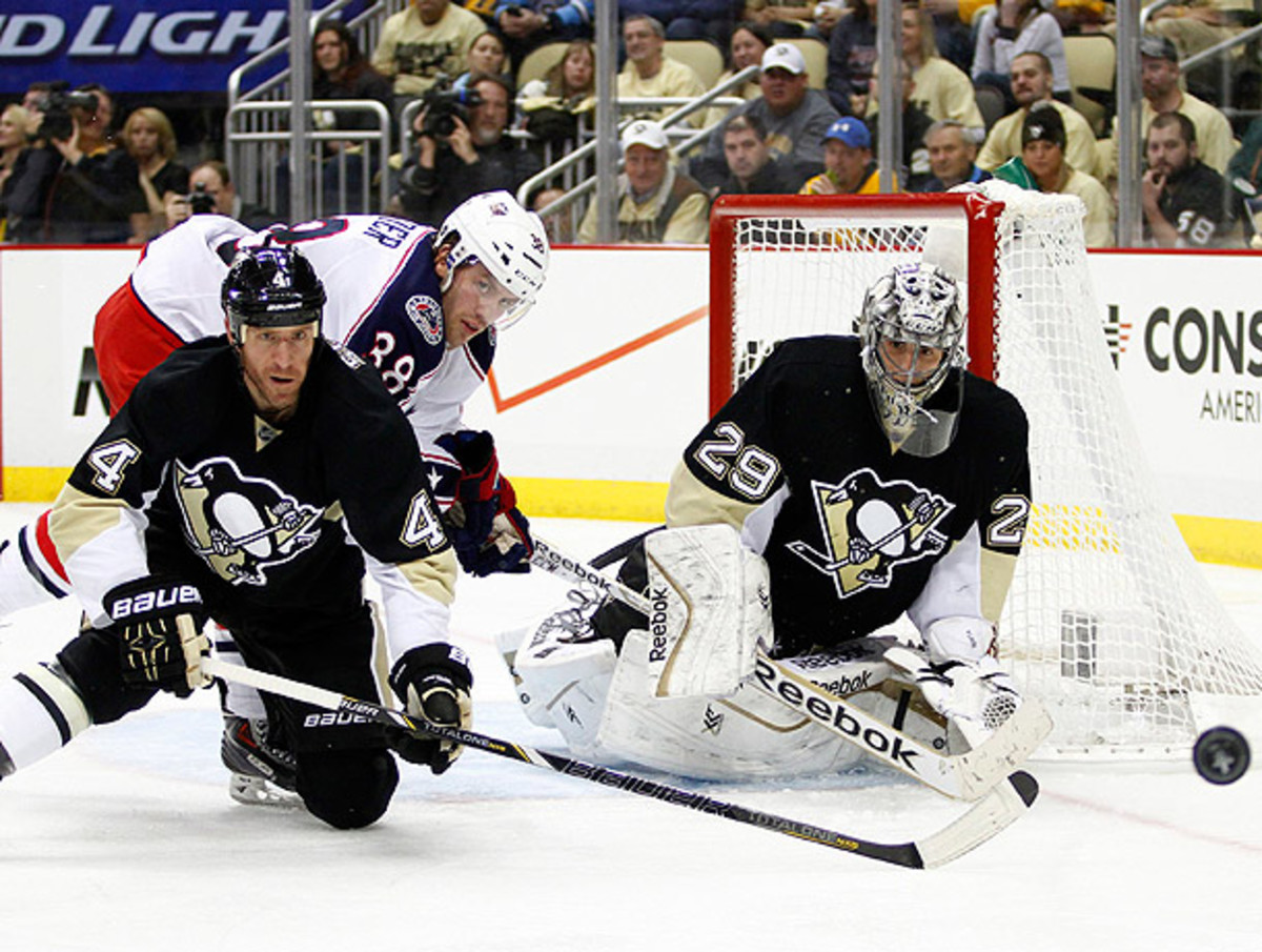 Marc-Andre Fleury (right) and the Penguins had to battle for a comeback win over Columbus. (Justin K. Aller/Getty Images)