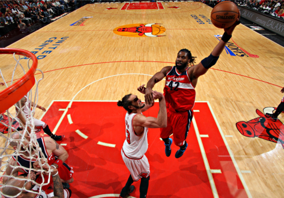Nene helps Washington work the angles against a vaunted Chicago defense. (Gary Dineen/NBAE via Getty Images)