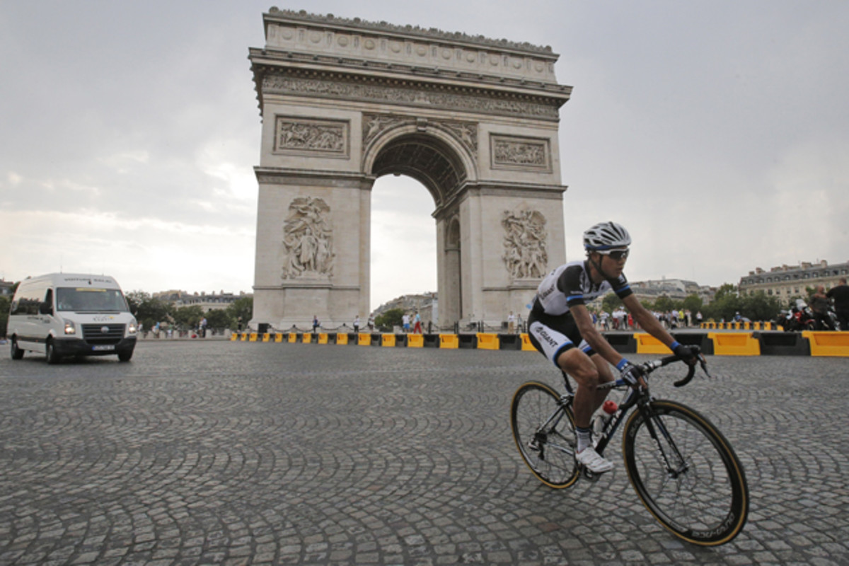 China's Cheng Ji passes the Arc de Triomphe during the twenty-first and last stage of the Tour de France.