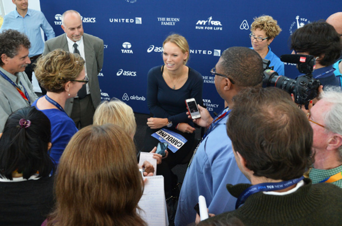 Wozniacki talks with reporters at the Jacob K. Javits Convention Center in anticipation for the NYC Marathon.