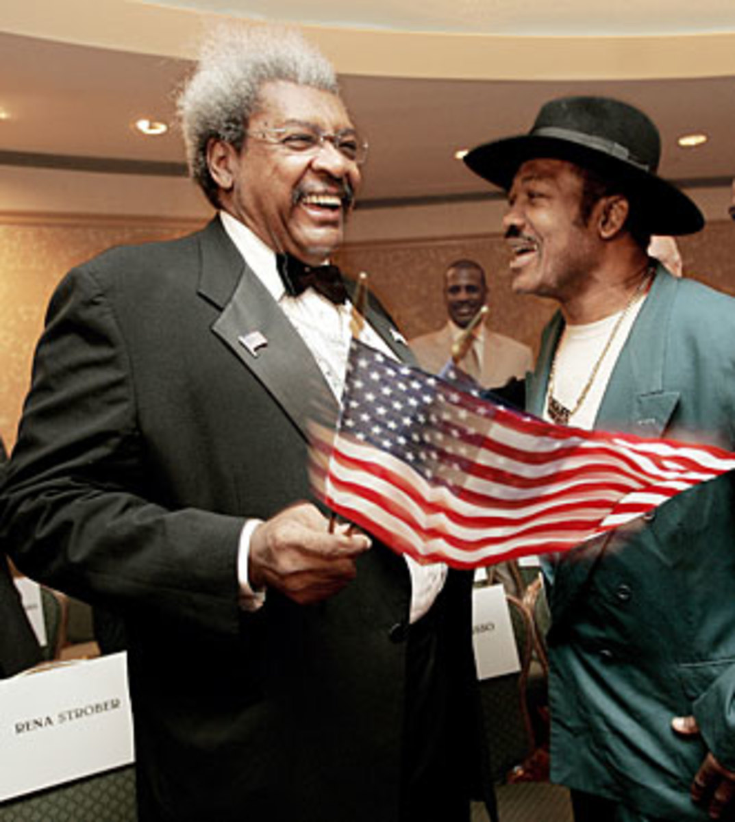 Don King once promoted Joe Frazier's fights, but now it was the ex-champ's turn to get some punches in.