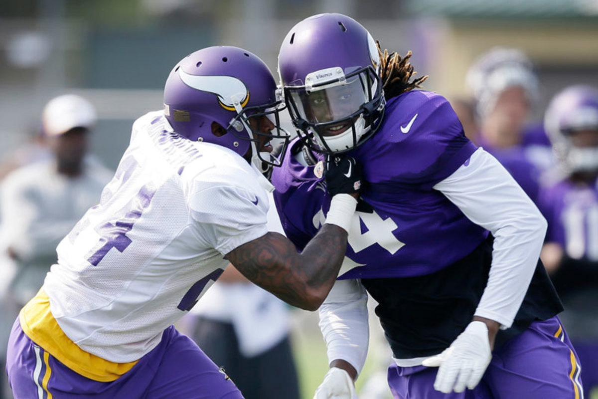 Newcomer Munnerlyn (left) has looked sharp, but he will be happy he doesn’t have to lock up with Patterson when the real games start. (Charlie Neibergall/AP)