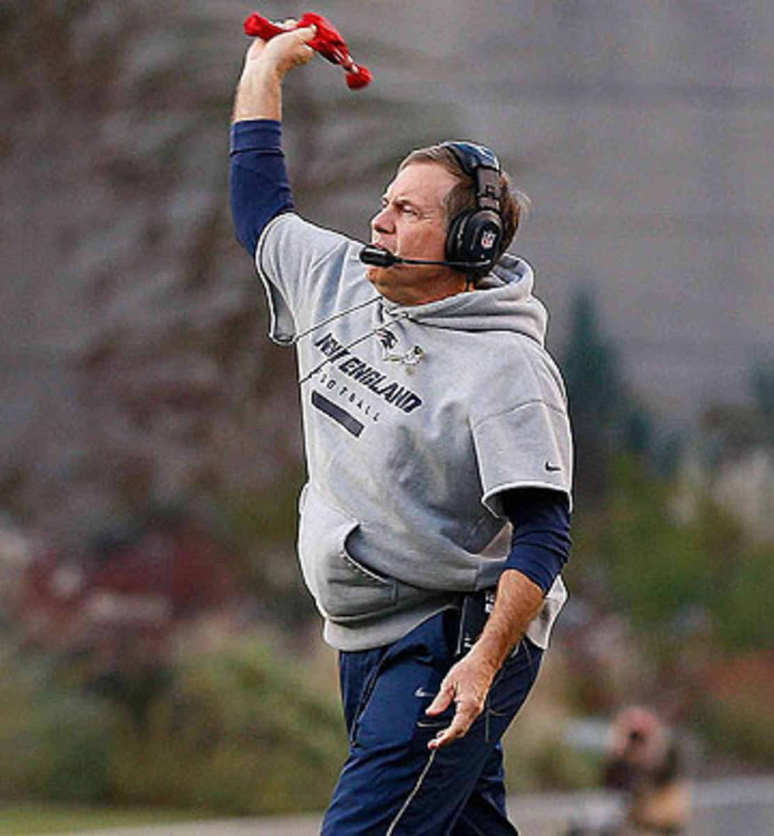 New England's Bill Belichick is in favor of coaches being allowed to challenge all calls. (Jim Rogash/Getty Images)