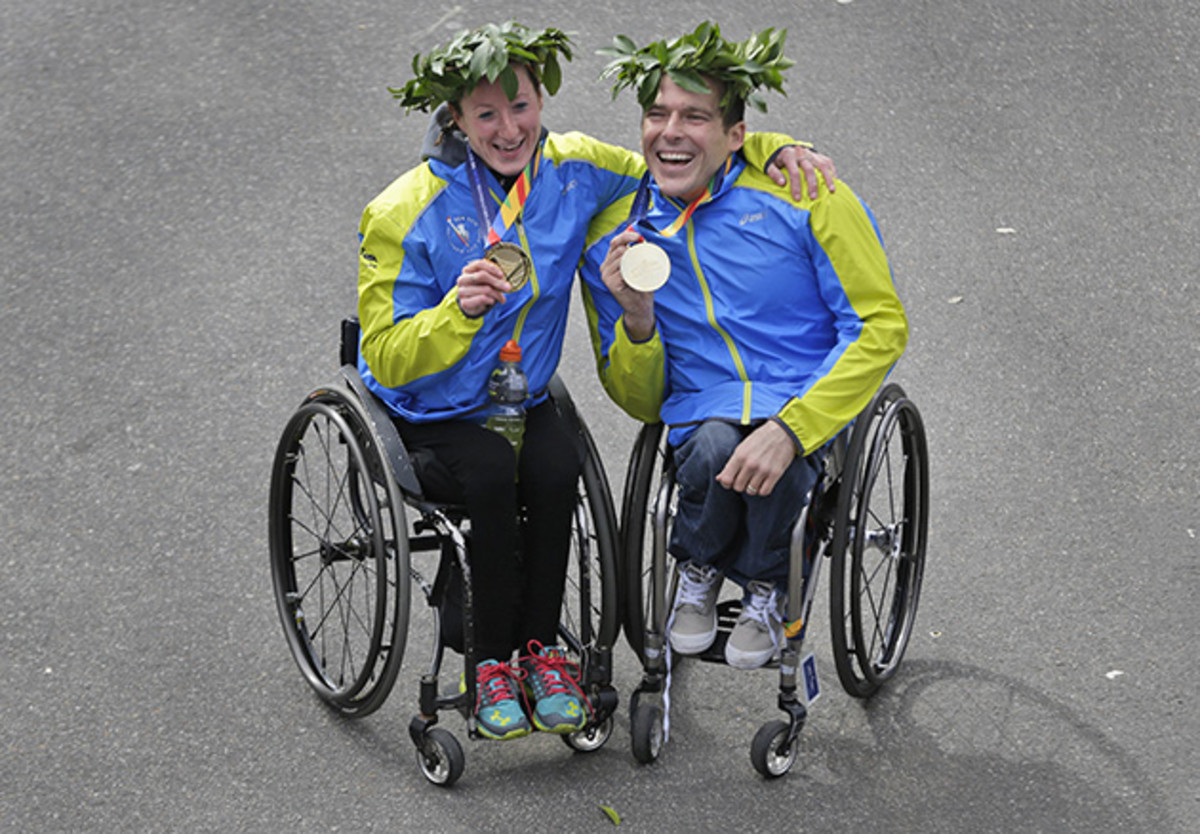 Kurt Fearnely and Tatyana McFadden, first place finishers in the wheeler divisions, pose for a picture at the 2014 New York City Marathon.