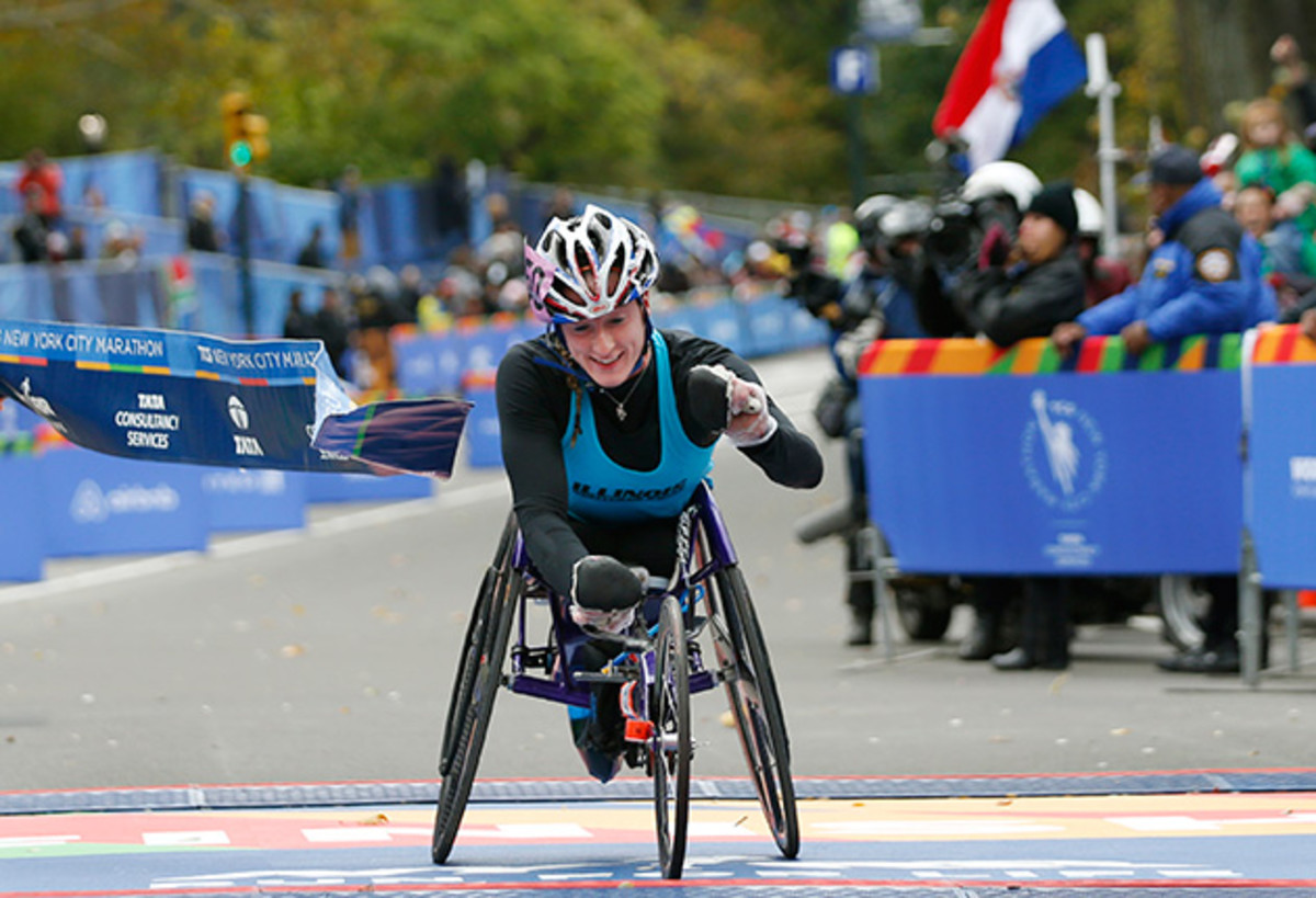 Tatyana McFadden breaks the tape after finishing first in the Women's wheelchair division of the 44th annual New York City Marathon.
