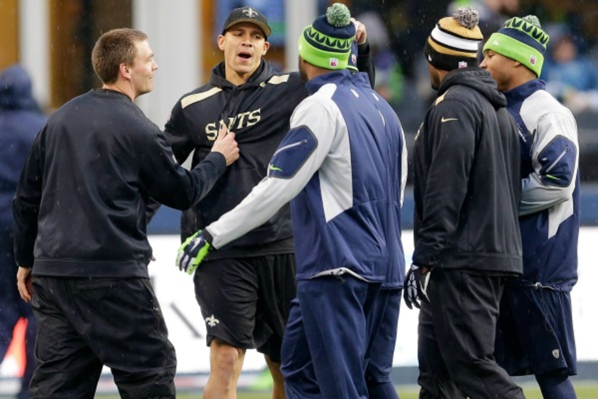 Jimmy Graham (center) had 1,215 receiving yards and 16 touchdowns this season. (Ted S. Warren/AP Images)
