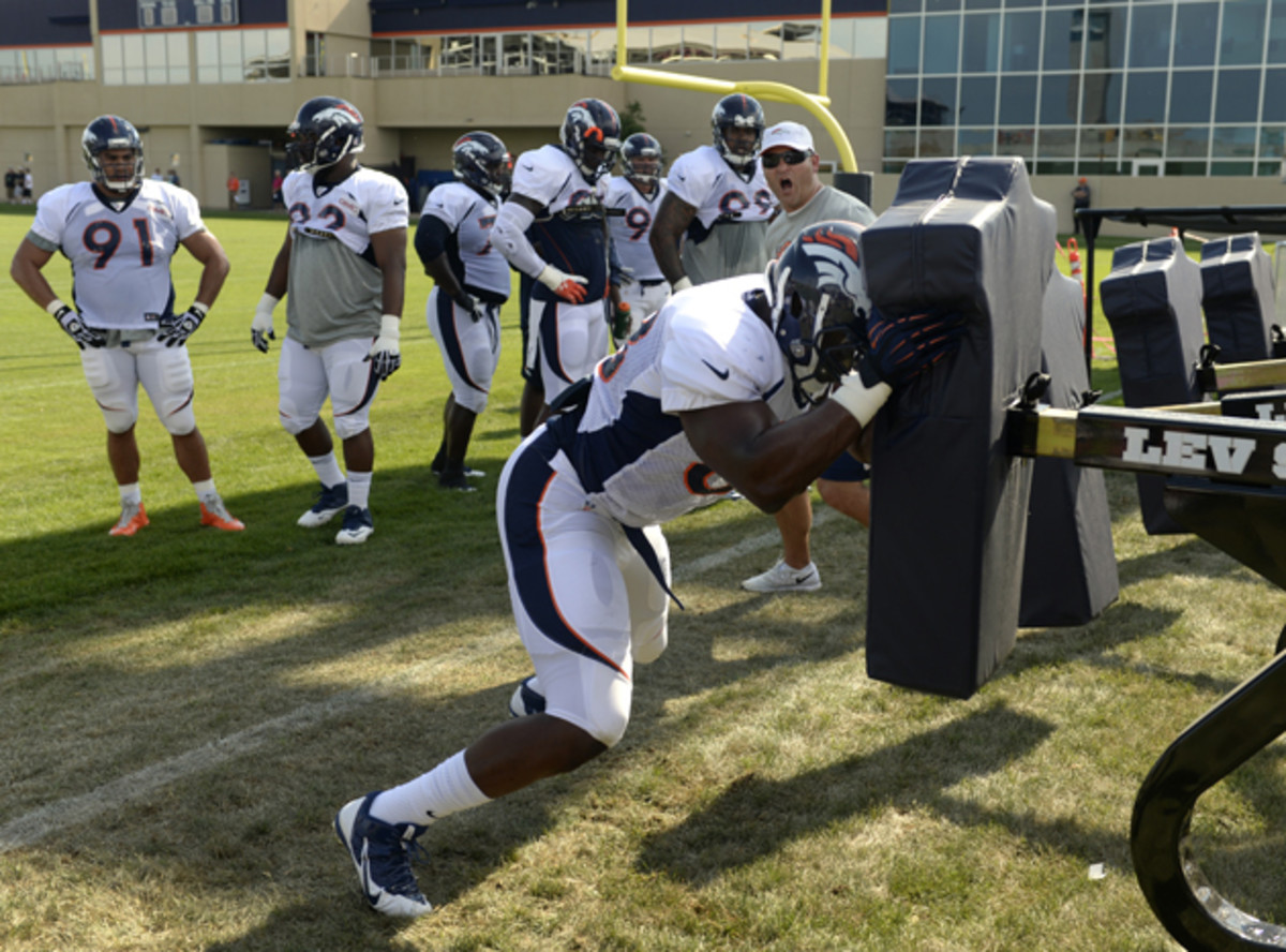 Kenny Anunike (68) runs through drills on during training camp in July.