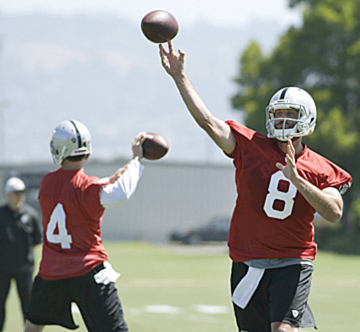 With his job potentially on the line, Allen will have to choose between underwhelming veteran Schaub (right) or unproven rookie Carr (left). (Ben Margot/AP)