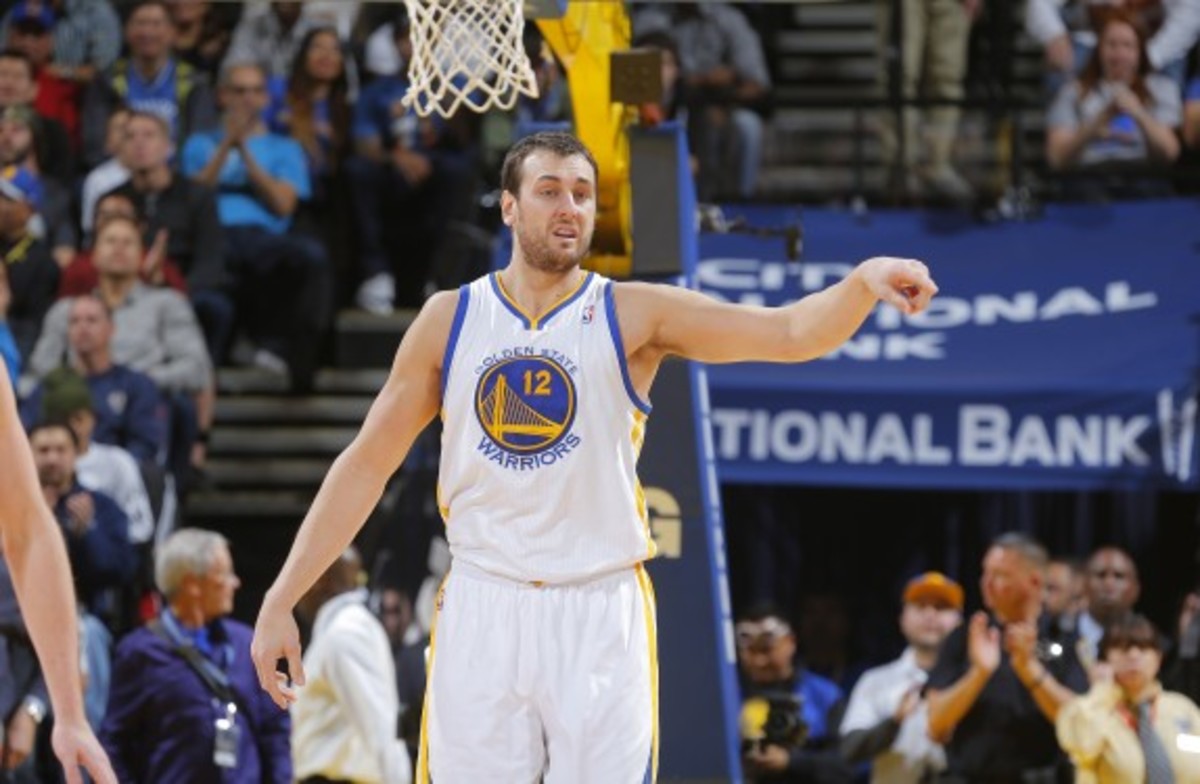 Andrew Bogut is averaging 7.6 points and 10.1 rebounds in 63 games this season. (Rocky Widner/Getty Images)