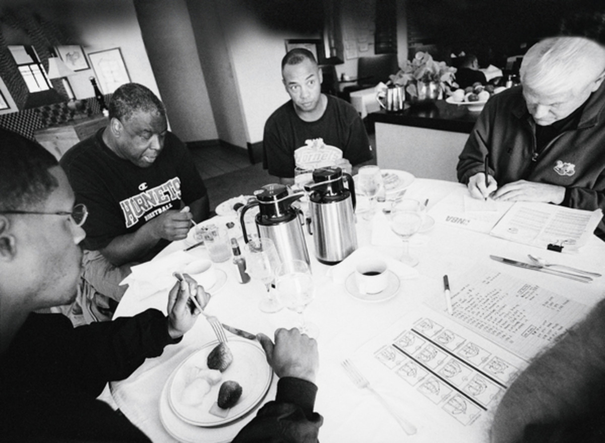 Hornets assistant coaches Stephen Silas, Jerry Eaves and Lee Rose with Paul Silas :: Lynn Johnson/SI 