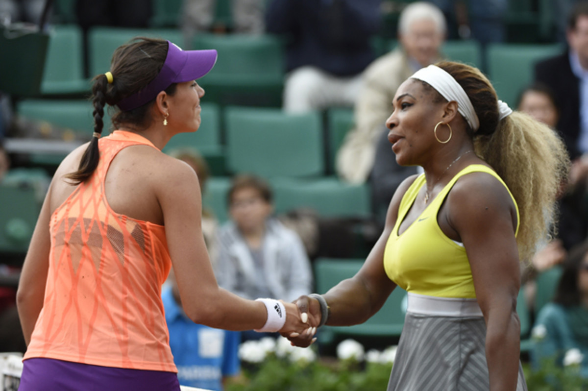 Muguruza shakes hands with Serena Williams at the end of their French tennis Open second round match at the Roland Garros stadium in May 2014.